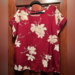 Lightweight, short-sleeve spring floral blouse with cuffed sleeves